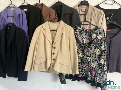 a lot of jackets hanging on a clothes rack