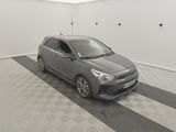 the grey car is parked in the garage on the checkered floor