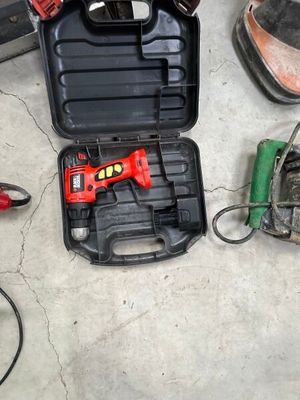a tool box with tools on the floor next to a pair of shoes
