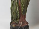 an old statue of a woman holding a baby in her arms