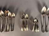 a lot of spoons and spoon spoons on the table