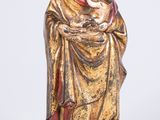 a statue of a woman holding a baby in her arms