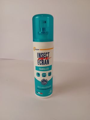 a close up of a bottle of insect cream on a white surface
