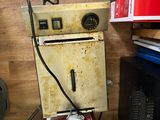 a small machine that is sitting on a wooden floor