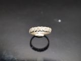 a close up of a ring on a table with a black background