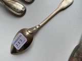 a lot of spoons and spoon spoons on the table