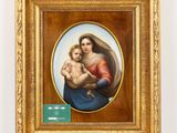 a painting of a woman holding a baby in a gold frame