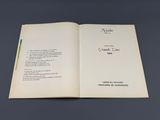 a book open to a page with a poem on it
