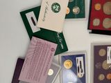 many different types of coins on display on a table