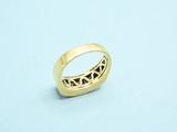 a close up of a gold ring on a blue surface