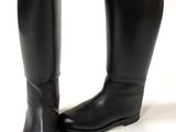 pair of black leather riding boots on a white background