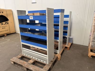 a group of pallets sitting on top of pallets in a warehouse