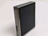 a picture of a cell phone sitting on a white surface