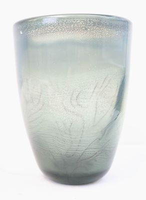 a glass vase with a pattern on it on a white surface