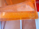 a piece of plastic that is sitting on top of a table
