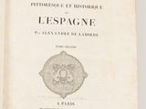 an old book with a picture of a lion on it