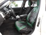 a picture of the inside of a car with the seat covers down