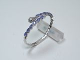 a picture of a ring with blue and white diamonds