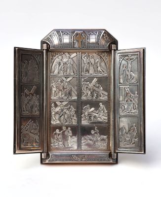 an image of a silver case with a picture of a scene inside of it