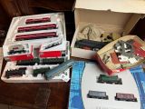 a lot of toy trains in a box on a table