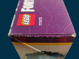 a purple box with a lego figure on top of it