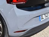 a close up of the rear end of a white car