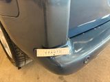 a close up of a car with a sticker on it ' s bumper