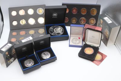 several different types of coins are in a box on a table