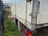 a white truck that is parked on the side of the road