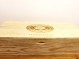 a wooden box with a logo on it sitting on a table