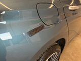 a close up of a car ' s door handle with a sticker on it