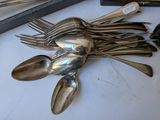 a lot of spoons and spoon spoons on a table
