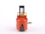 a small toy forklift truck with a dog on it