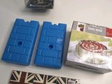 a box of cake sitting on a table next to a container of cake