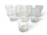 six glasses of water sitting next to each other on a white surface