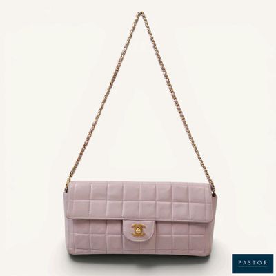 a pink chanel bag on a white background