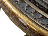 a close up of a metal table with a clock on top of it