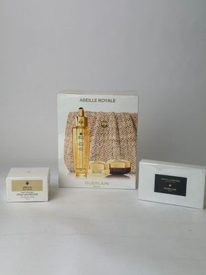 an image of a couple of boxes of perfume sitting on a table