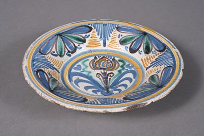 an image of a blue and yellow bowl with a flower design on it