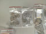 a lot of coins in the bags on the table