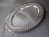 a silver plate that is sitting on a table