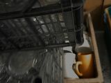 a dishwasher that is full of dishes in the kitchen