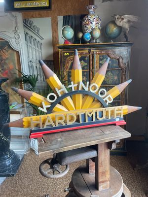 a wooden table with a bunch of pencils on top of it