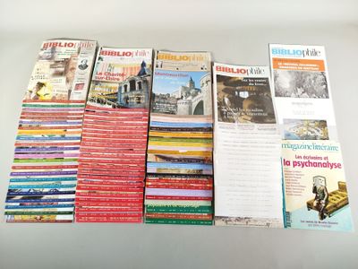 a lot of books that are stacked on top of each other