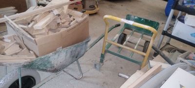 a wheelbarrow that is being built in a garage