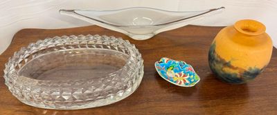 a glass bowl and a glass bowl on a table