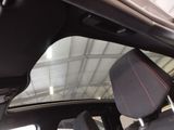 a view of the inside of a car from the driver ' s seat