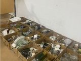 many boxes of assorted items sitting on the floor