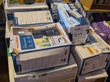 many boxes stacked on top of each other on the floor