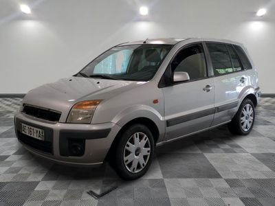 a picture of a silver car parked in a garage